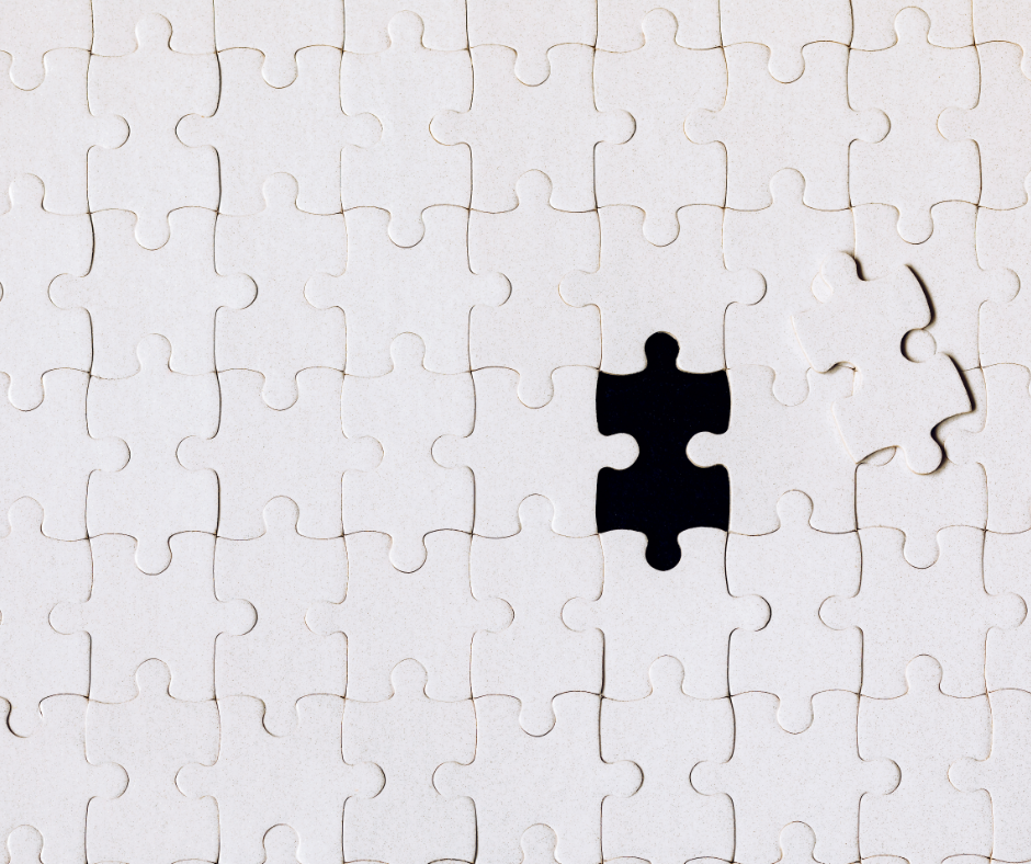 one missing puzzle piece in a large white puzzle