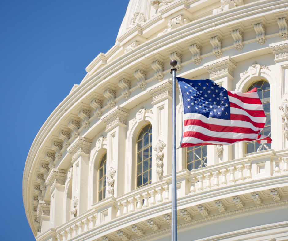 American flag flying in front of capitol