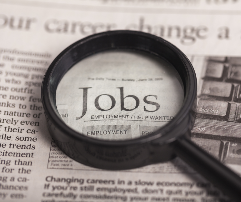newspaper reading jobs with magnifying glass on top