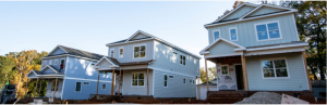 the front view of three houses in a row