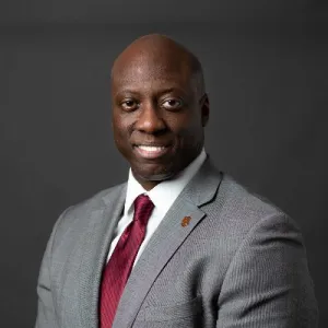 professional headshot of Malik S. Henfield