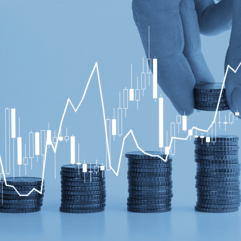 coins stacked in ascending amounts with a chart overlay showing ups and downs