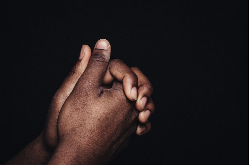 hands clasped together