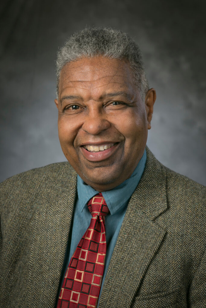 Professional headshot of William Darity