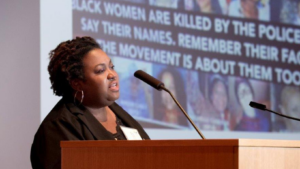 Woman presenting research on policing