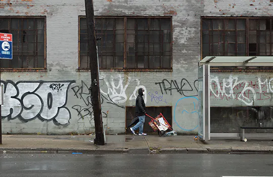 man walking on sidewalk