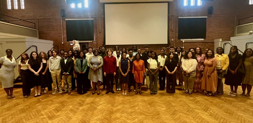 Students and instructors from the 10th cohort of Young Scholars, gathered in the Durham Armory on July 28.